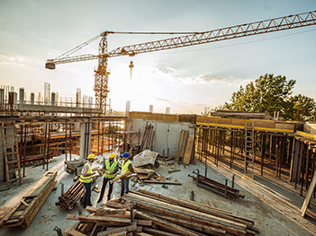 Construction Site With Crane and Workers